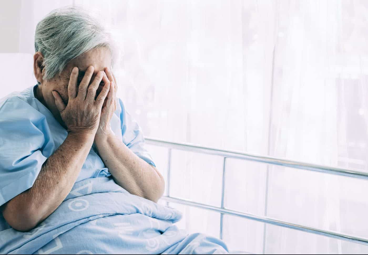 Elderly woman thinking about Houston First Party Insurance Lawyers