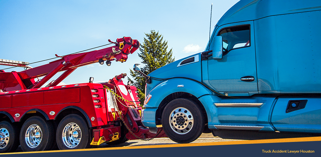 Truck Accident between a blue commercial truck and a red crane truck