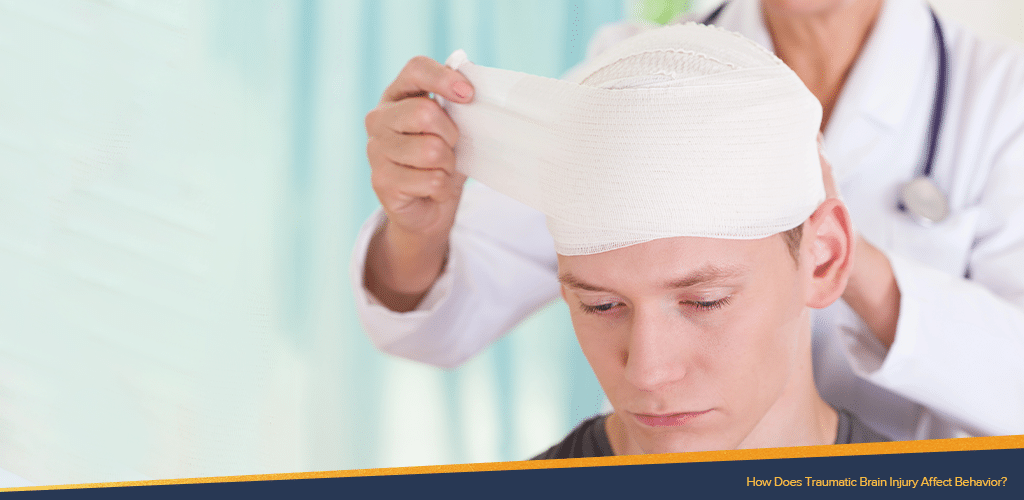 A doctor wrapping a bandage to patient's head affected by traumatic brain injury