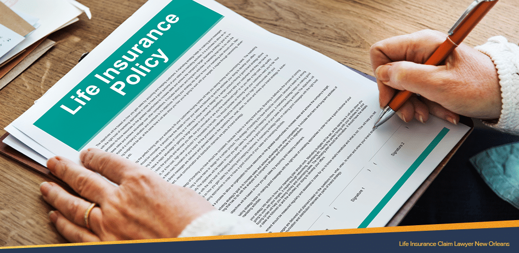 an unseen woman holding a pen reading the life insurance policy document