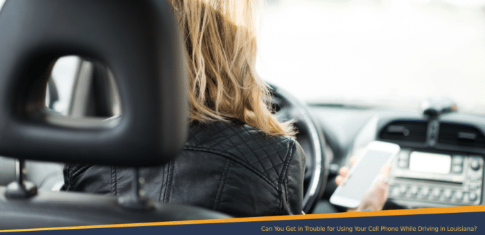 Woman using her cell phone while driving
