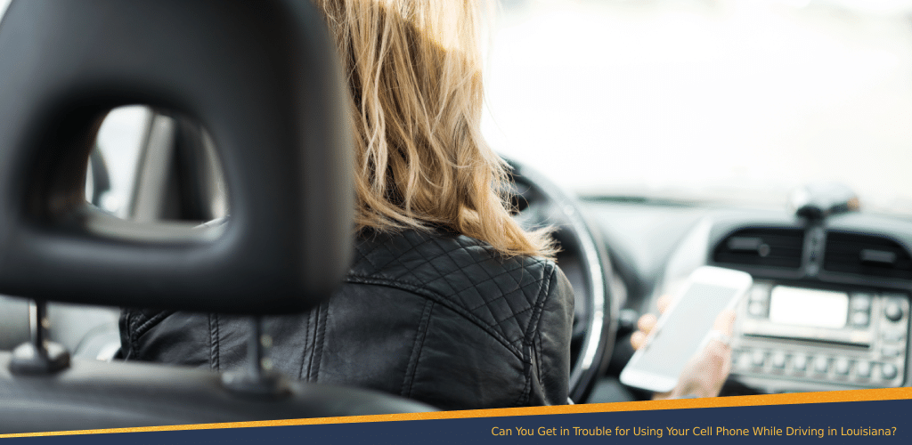 Woman using her cell phone while driving